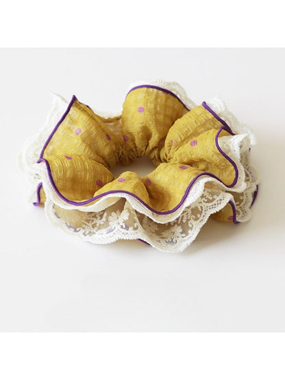 Side view of Gifty ruffled scrunchie highlighting fabric layers