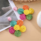 Earedge minimalist flower drop earrings displayed alongside matching accessories