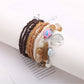 Lovra tree shape tassel pendant beaded bracelet shown with natural lighting and shadows