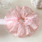 Gifty scrunchie in soft pastel colors with vintage floral pattern