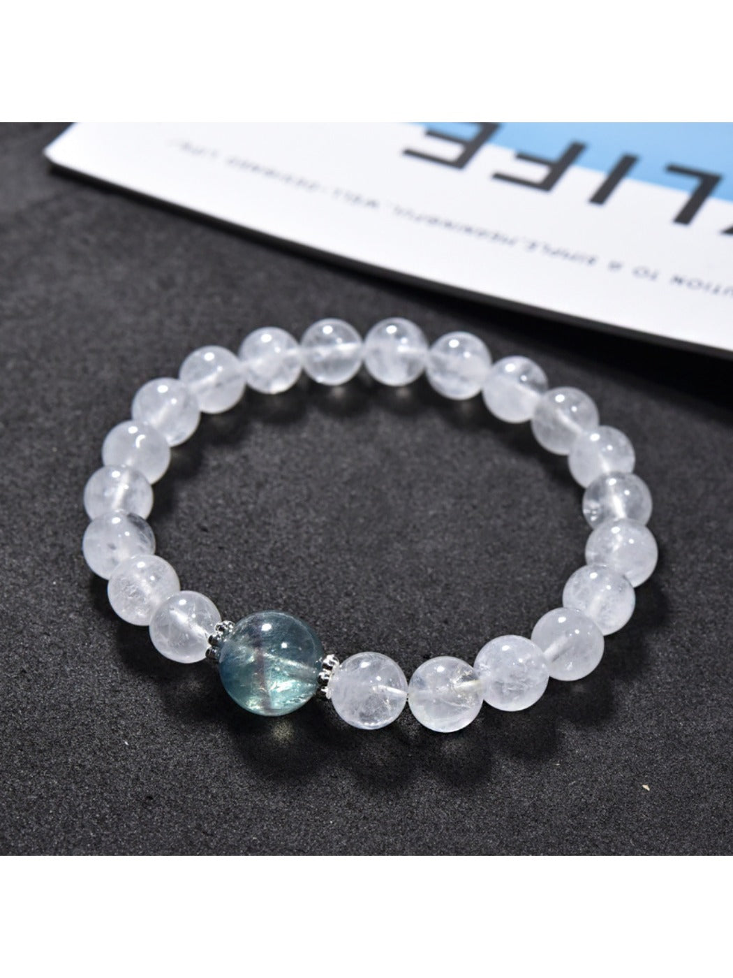 Close-up of clear quartz beads on Lovra minimalist beaded bracelet