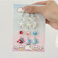 Mini fish shaped keychain in blue with a silver keyring attached