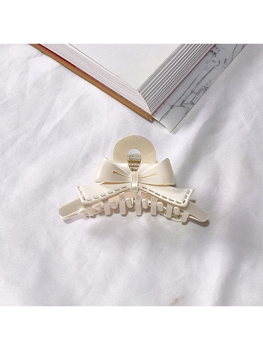 Beau acetate bow shaped claw clip with focus on bow knot detail