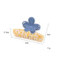 Side view of Beau flower shaped color block claw clip highlighting clip mechanism