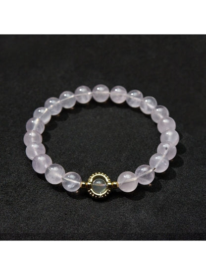 Lovra bracelet arranged in a circle with pastel beads in soft pink, blue, and cream tones