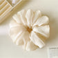 Gifty Pure Simple Mesh Scrunchie styled in a ponytail on model
