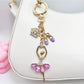 Ballerina charm keychain displayed hanging from a handbag strap