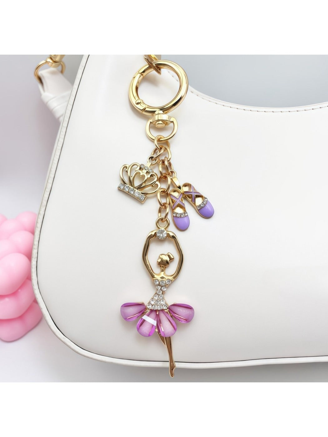 Ballerina charm keychain displayed hanging from a handbag strap