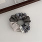Gifty vintage patchwork plaid scrunchie worn in a ponytail