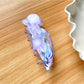 Beau jellyfish claw clip packaged in a clear plastic box with branding label