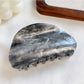 Beau hair claw clip worn in hair demonstrating elegant hold and cloud pattern