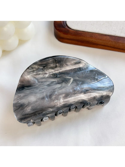 Beau hair claw clip worn in hair demonstrating elegant hold and cloud pattern