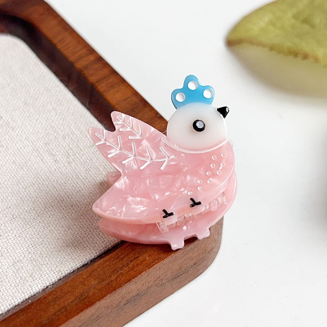 Pink winged bird hair claw clip