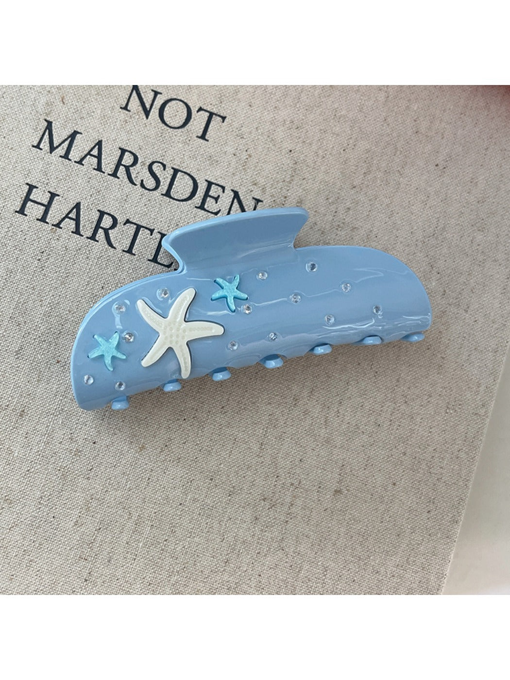Beau starfish hair claw clip shown from the back with visible spring mechanism