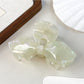 Beau hair claw clip shown from bottom to reveal teeth design