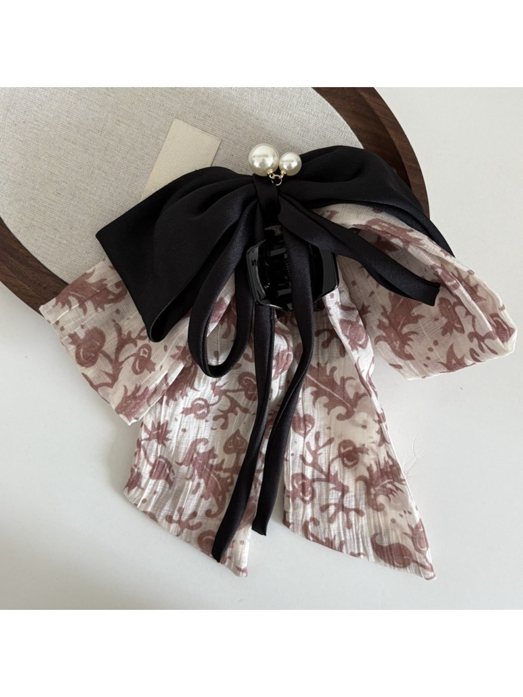 Beau Ink Wash Bow Ribbon Claw Clip with soft lighting emphasizing texture