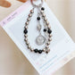Hand holding Keypus beaded heart pendant keychain showing size and detail