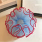 Blue tulle scrunchie with red trim displayed flat