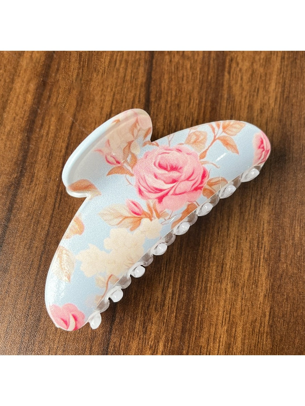 Beau colorful flower pattern hair clip photographed with natural lighting