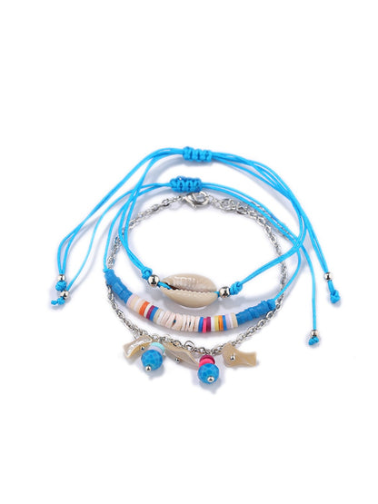 Lovra Earedge Ocean Style bracelet worn on wrist showcasing layered blue and silver beads