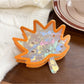 Beau vintage leaf shaped hair claw clip styled in long brown hair