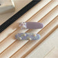 Side view of Beau tiny flower hair clip showing clip mechanism