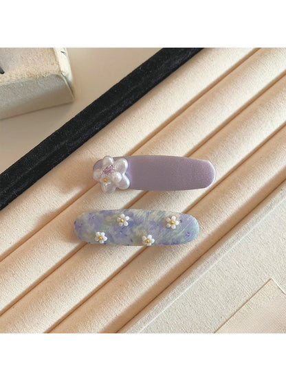 Side view of Beau tiny flower hair clip showing clip mechanism
