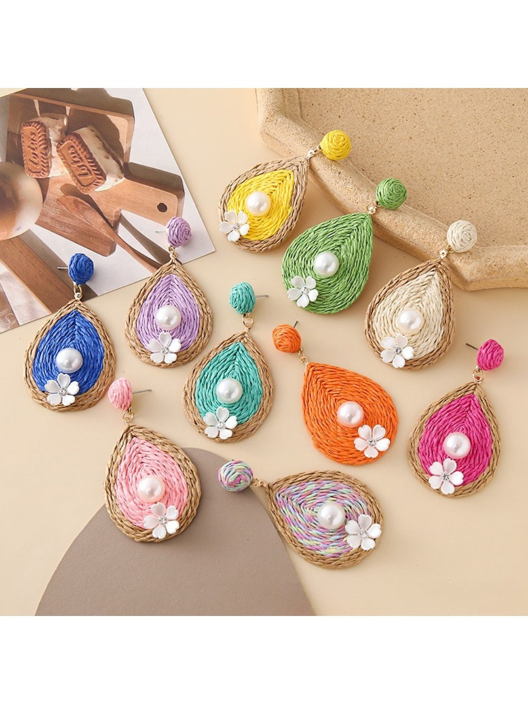 Close-up of Earedge chic teardrop drop earrings on white background