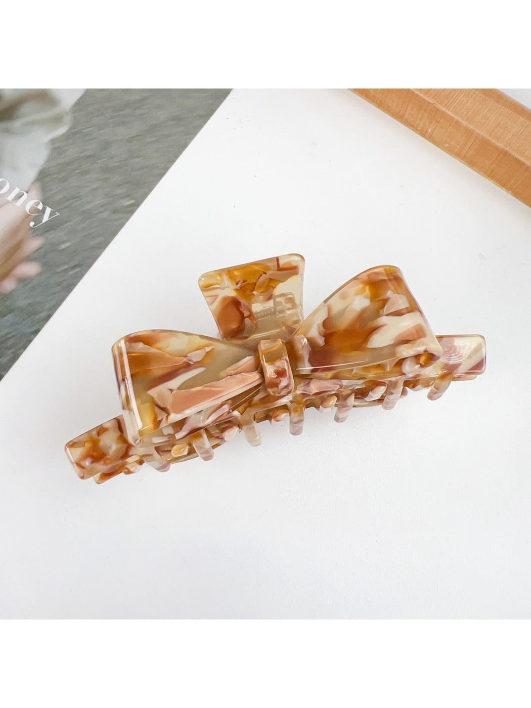 Beau claw clip used to hold thick hair in a casual hairstyle