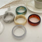 Lovra vintage minimalist round bangle bracelet in polished gold finish on white background