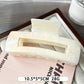 Beau marble pattern square claw clip with light reflecting off its glossy finish