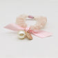 Gifty Sweet Bow Embellished Hair Tie styled in a ponytail on a model with dark hair