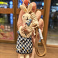 Fabric rabbit keychain displayed on a white background with clear lighting