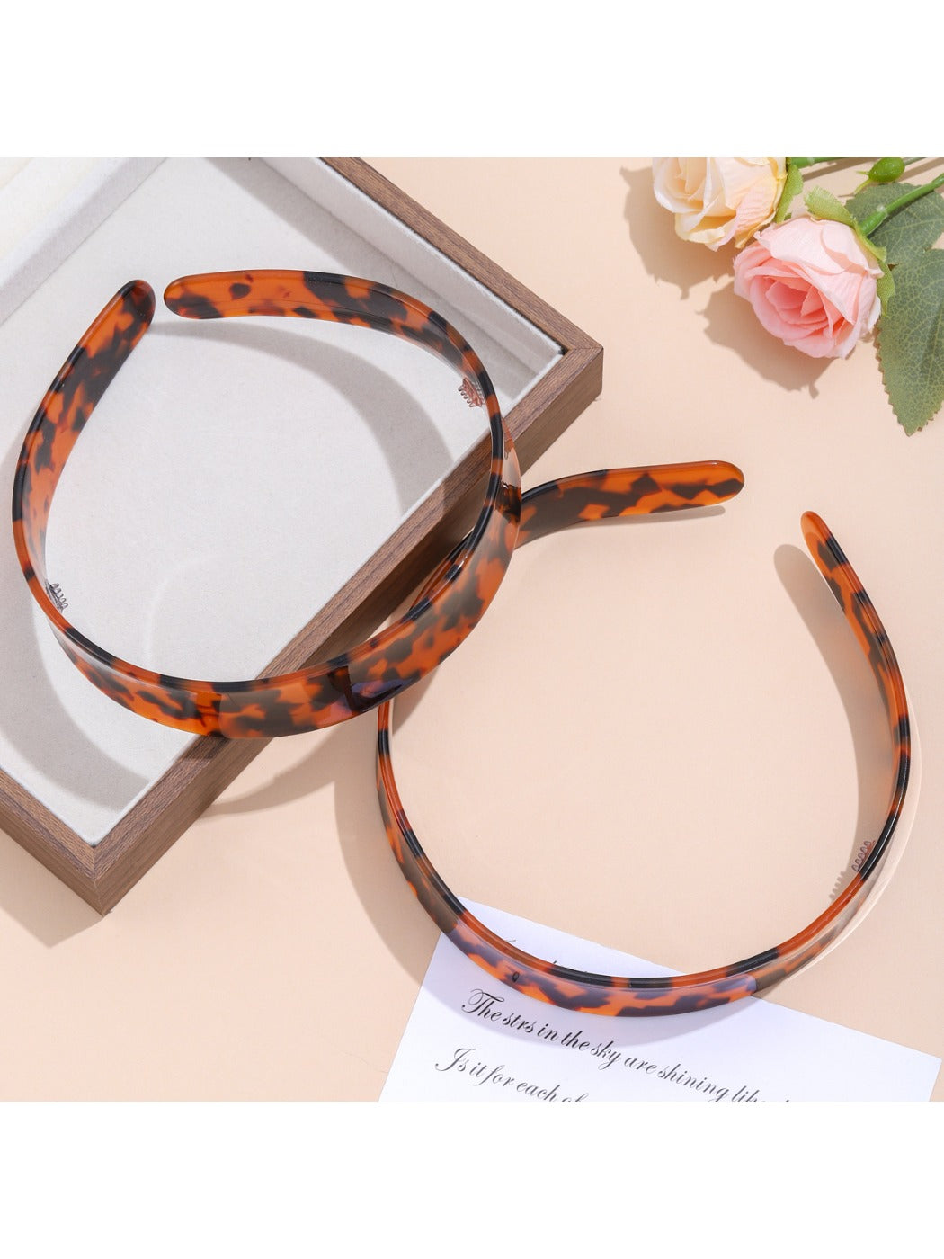 Side view of leopard print headband showing fabric pattern and shape