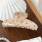 Beau brown butterfly print claw clip with open claws showing teeth detail