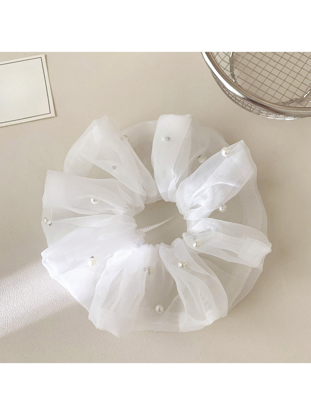 Gifty tulle scrunchie displayed on a white background highlighting its volume