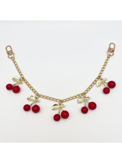 Cherry charm resting on a marble countertop with natural light