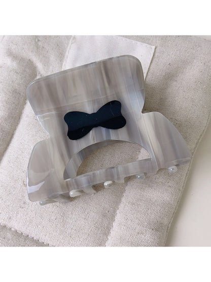 Beau openwork hair claw clip shown from top angle emphasizing symmetrical design