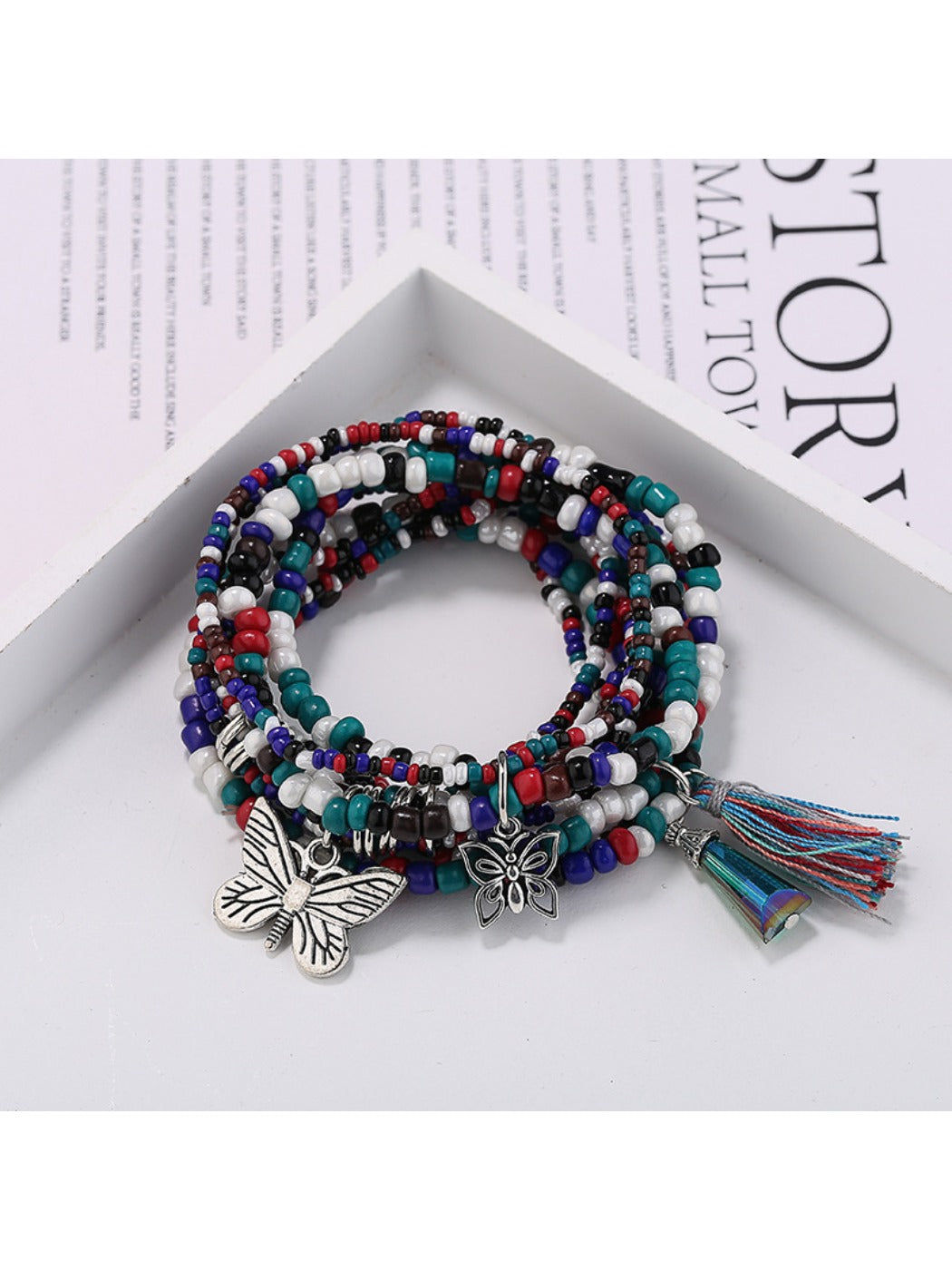 Lovra butterfly pendant bracelet worn on wrist with natural lighting
