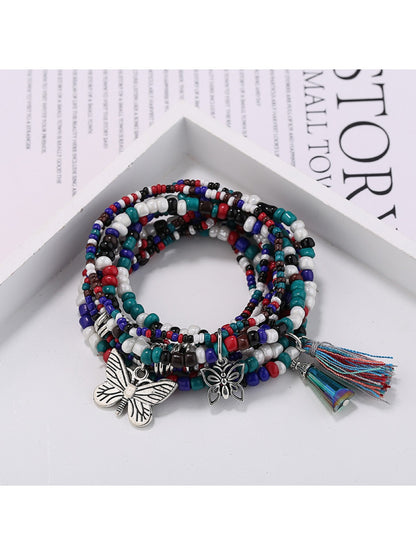 Lovra butterfly pendant bracelet worn on wrist with natural lighting