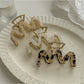 Close-up of Beau vintage wave line claw clip showing curved wave design