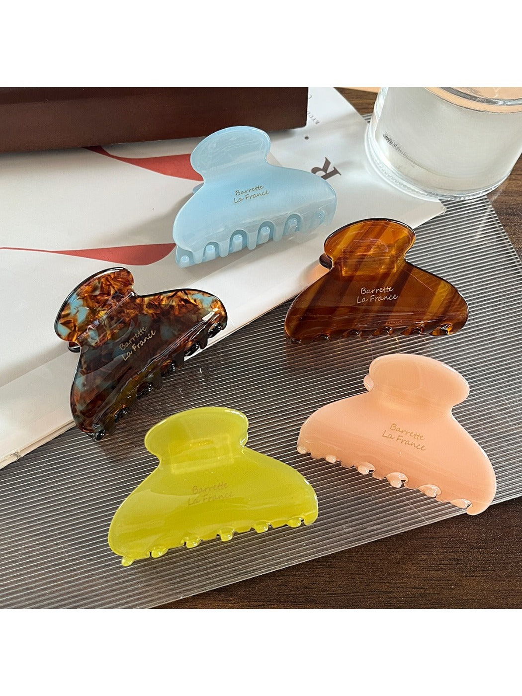 Close-up of Beau Sweet Chic acetate claw clip showing curved teeth and glossy finish