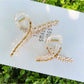 Side view of Beau elegant floral cross hair claw clip highlighting the claw mechanism