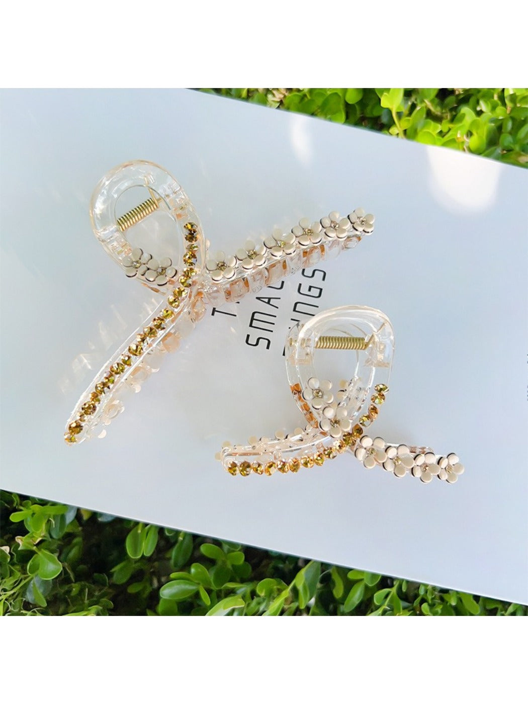 Side view of Beau elegant floral cross hair claw clip highlighting the claw mechanism