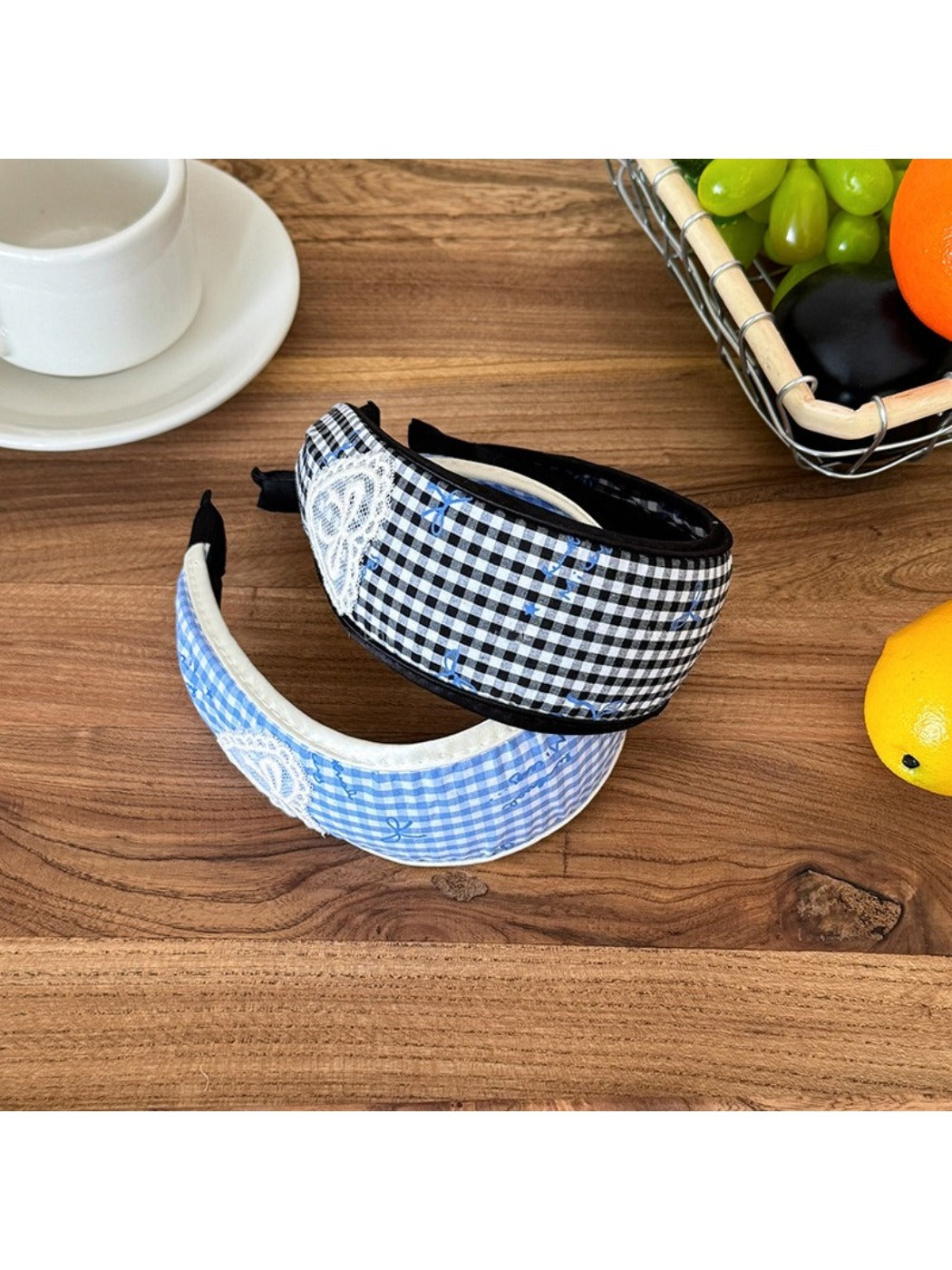 Close-up of Gifty plaid bow print headband showing fabric texture and pattern