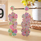 Earedge Bohemian drop earrings hanging on a decorative stand with natural light