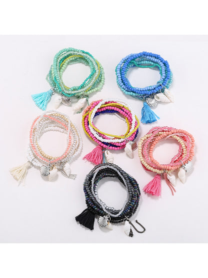 Lovra Ocean Style multi-row bracelet with blue and white beads on a white background