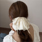 Close-up of Beau hair claw clip showing bow detail and smooth surface