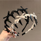 Gifty bow toothed non slip headband in soft fabric on white background