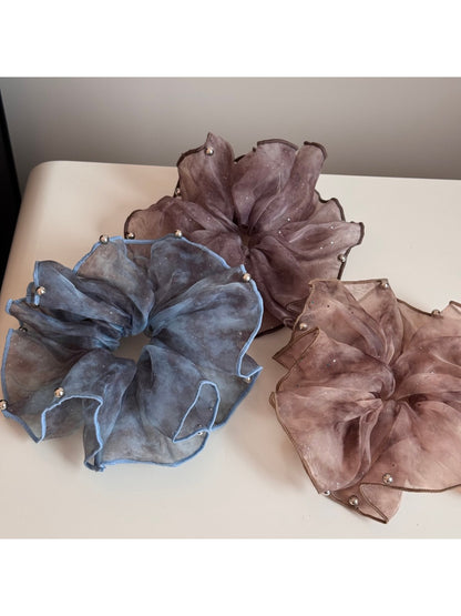 Side view of large pink tulle scrunchie with shimmering glitter